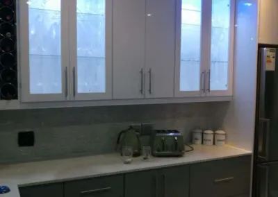 White kitchen cabinets with glass display doors