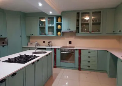Duck-egg blue kitchen with glass display cabinets