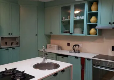 Duck-egg blue kitchen island with a gas hob